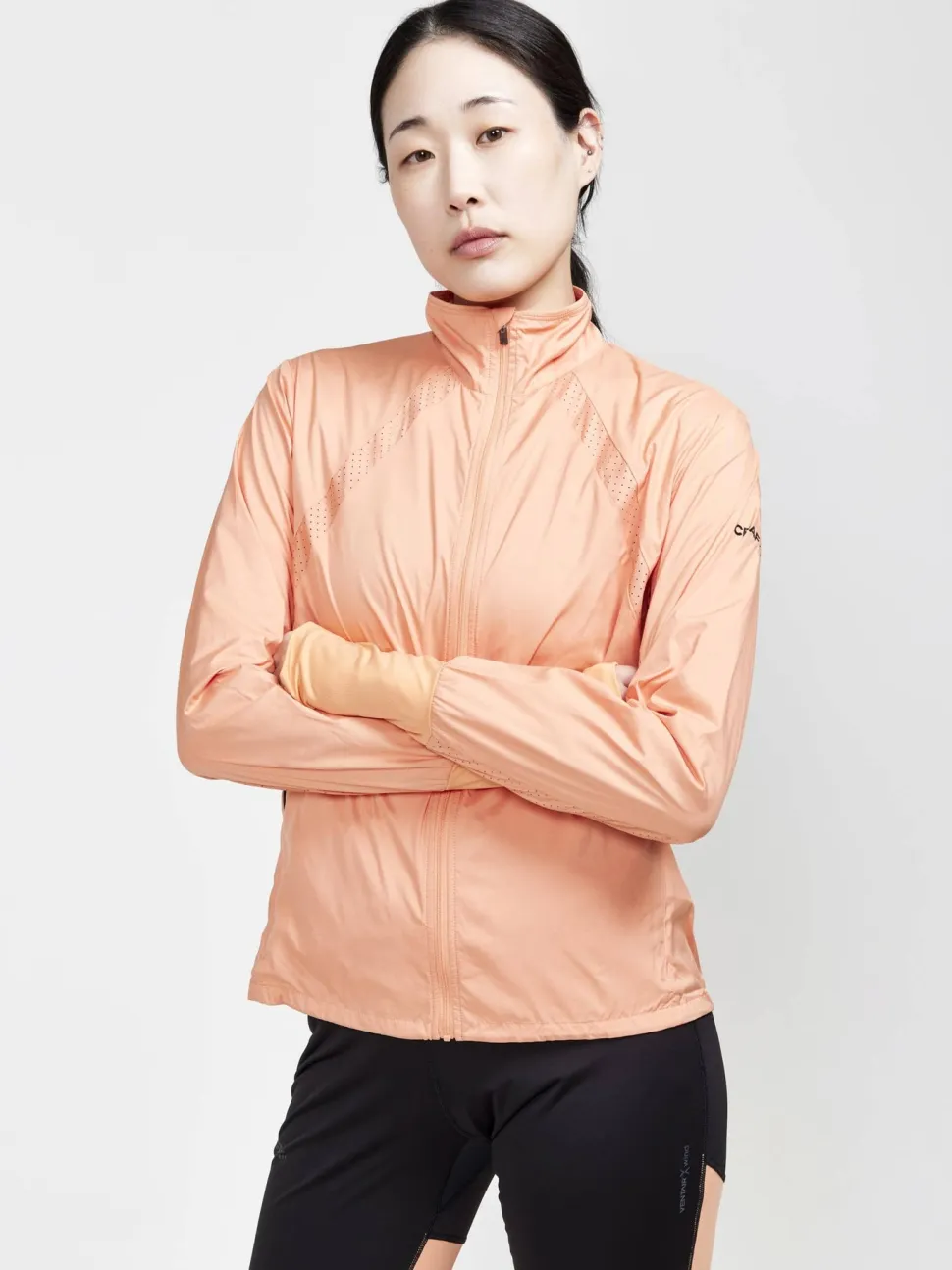 WOMEN'S ADV ESSENCE WIND JACKET - GLOW